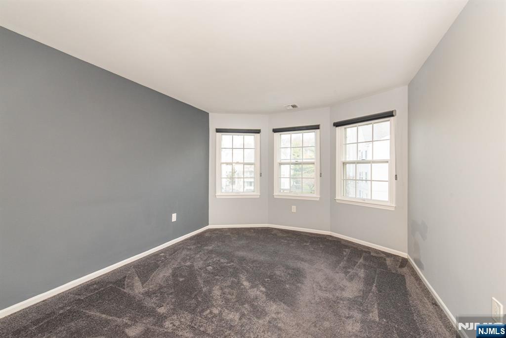 69 Amethyst Lane, Unit 283 Paterson, NJ 07501 - Photo 14 of 20 an empty room with windows
