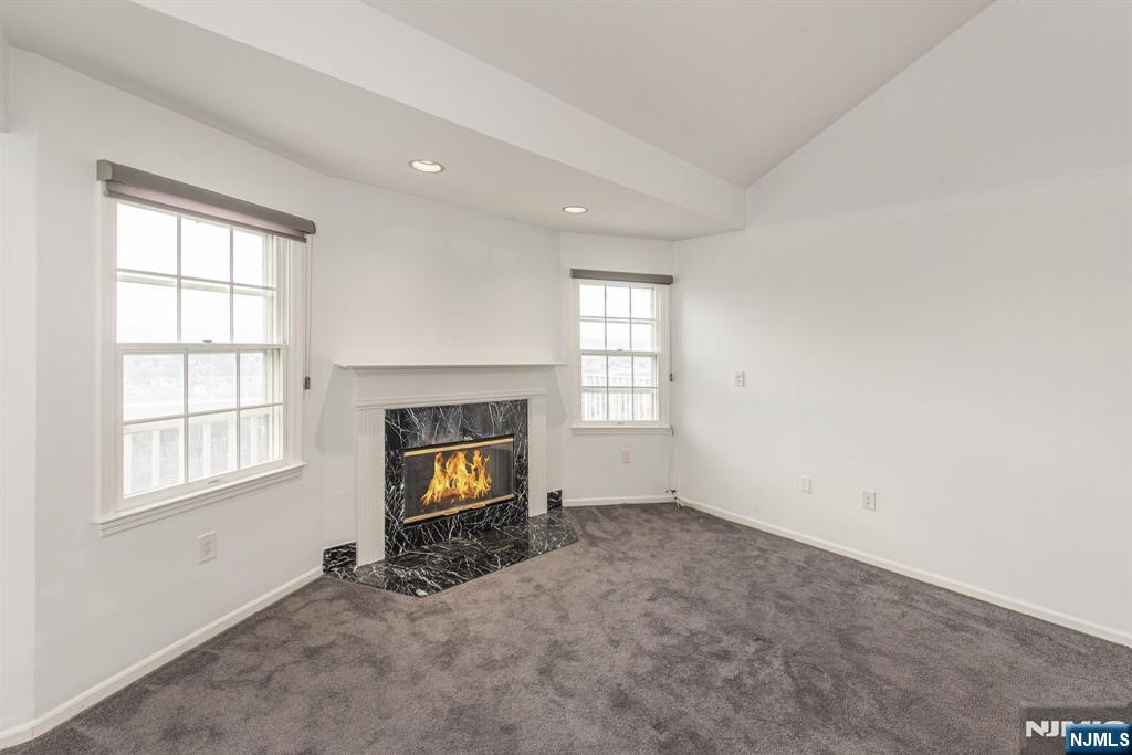 69 Amethyst Lane, Unit 283 Paterson, NJ 07501 - Photo 4 of 20 an empty room with windows