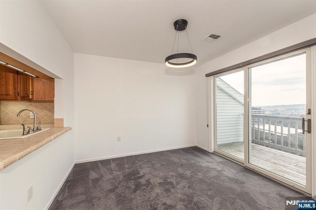 69 Amethyst Lane, Unit 283 Paterson, NJ 07501 - Photo 5 of 20 a view of a kitchen and a sink
