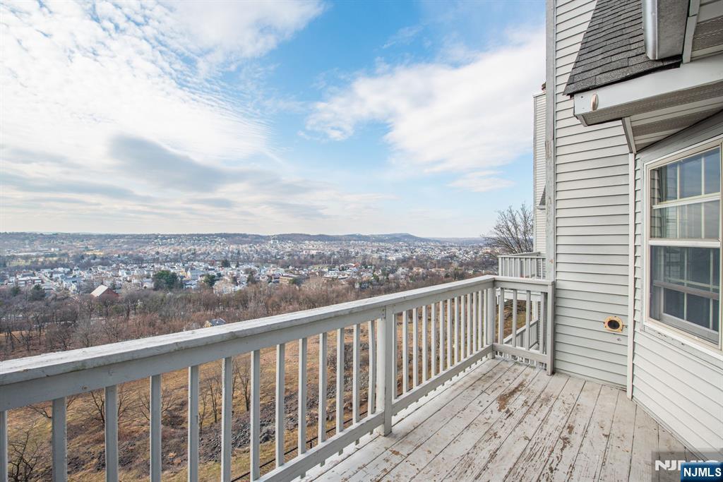 69 Amethyst Lane, Unit 283 Paterson, NJ 07501 - Photo 6 of 20 a view of a balcony with wooden floor