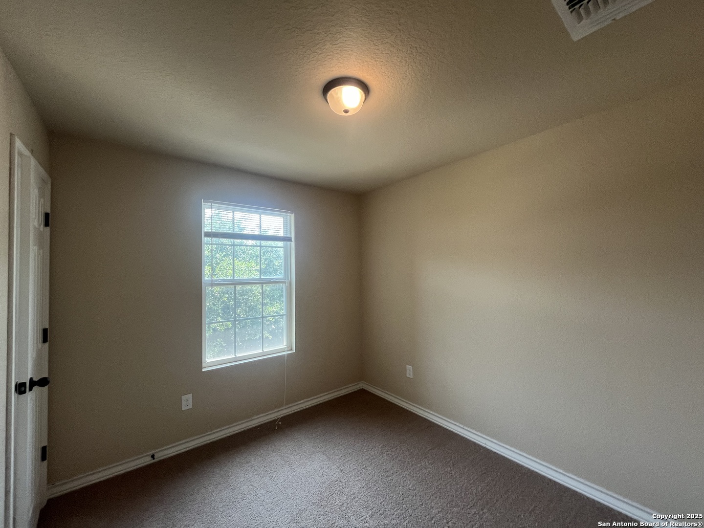 16824 Dancing Ava, Unit 1 Selma, TX 78154 - Photo 22 of 26 an empty room with a window
