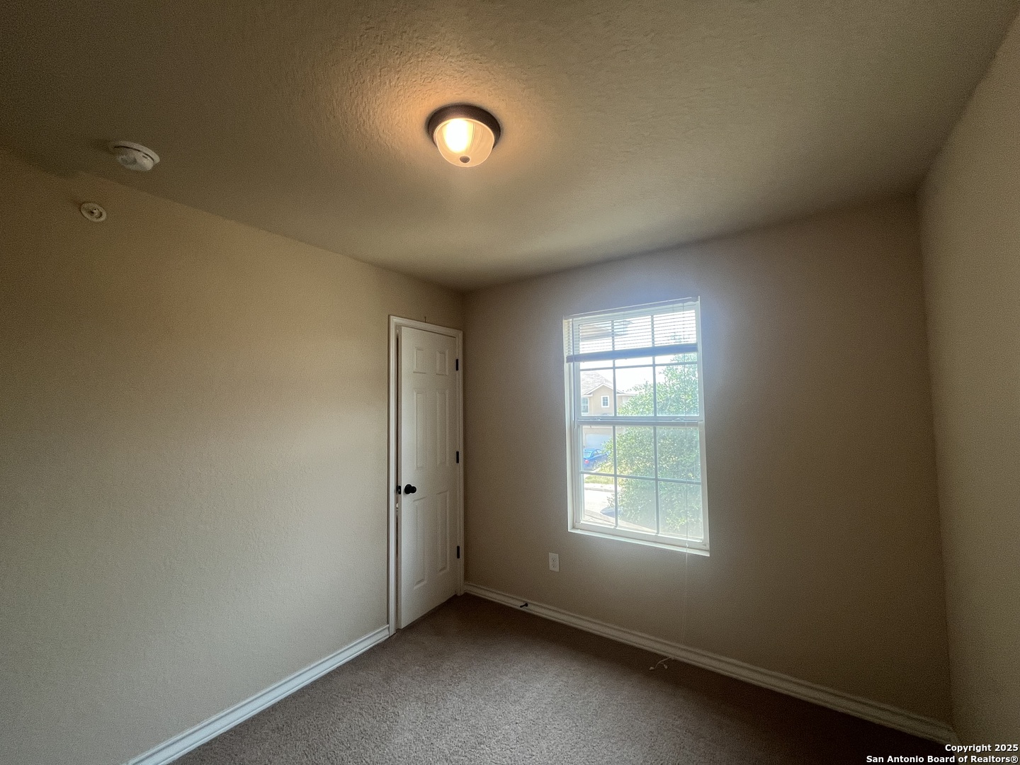16824 Dancing Ava, Unit 1 Selma, TX 78154 - Photo 23 of 26 an empty room with a window
