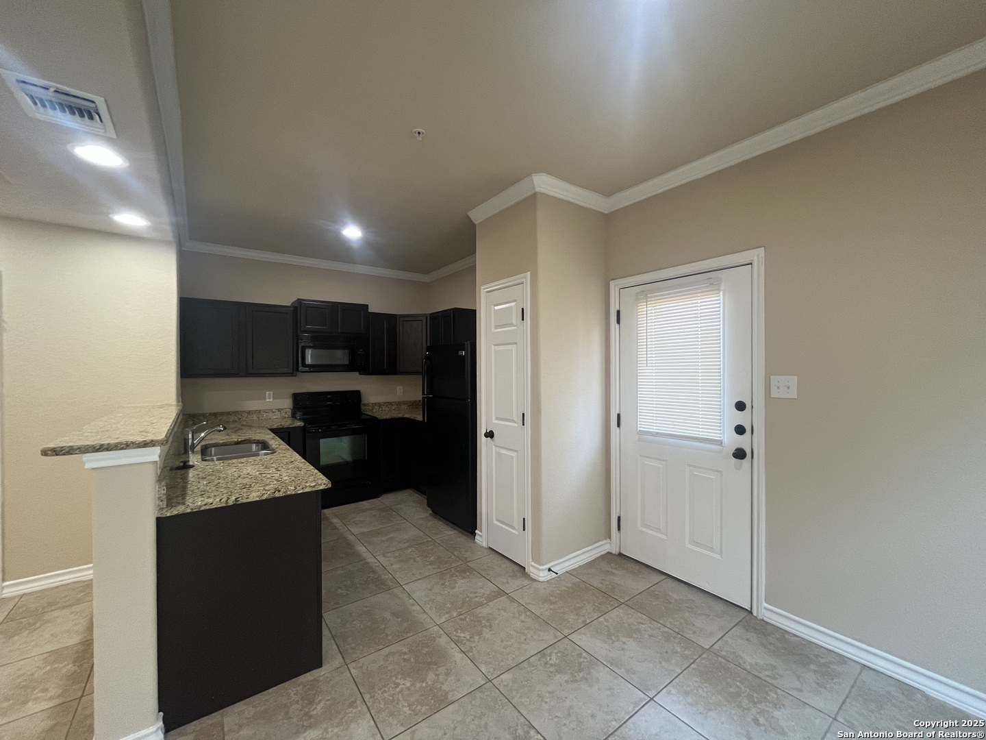 16824 Dancing Ava, Unit 1 Selma, TX 78154 - Photo 7 of 26 a room with a sink furniture and a mirror