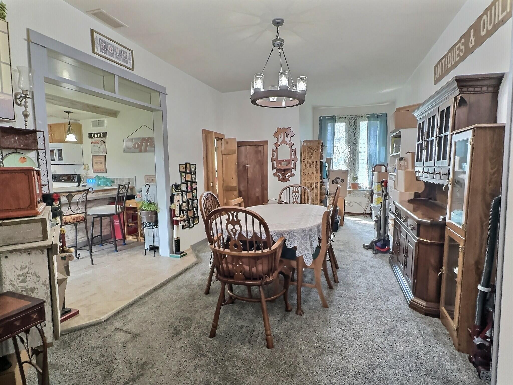 103 West Goss Street Kentland, IN 47951 - Photo 11 of 26 a view of a dining room with furniture window and outside view