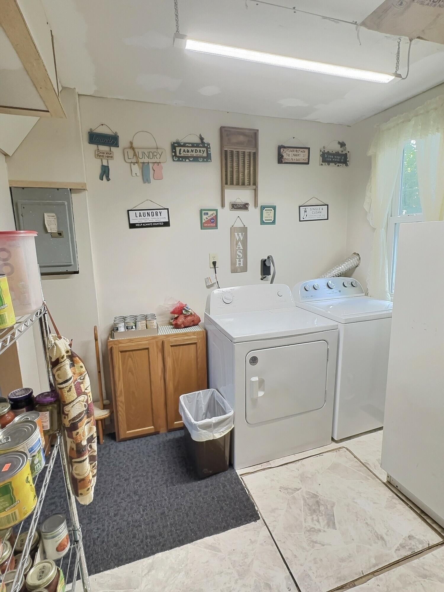 103 West Goss Street Kentland, IN 47951 - Photo 22 of 26 a utility room with sink dryer and washer