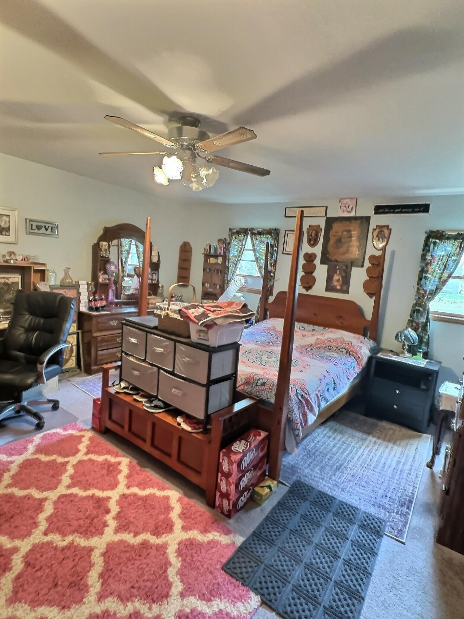 103 West Goss Street Kentland, IN 47951 - Photo 6 of 26 a bedroom with furniture and a dresser