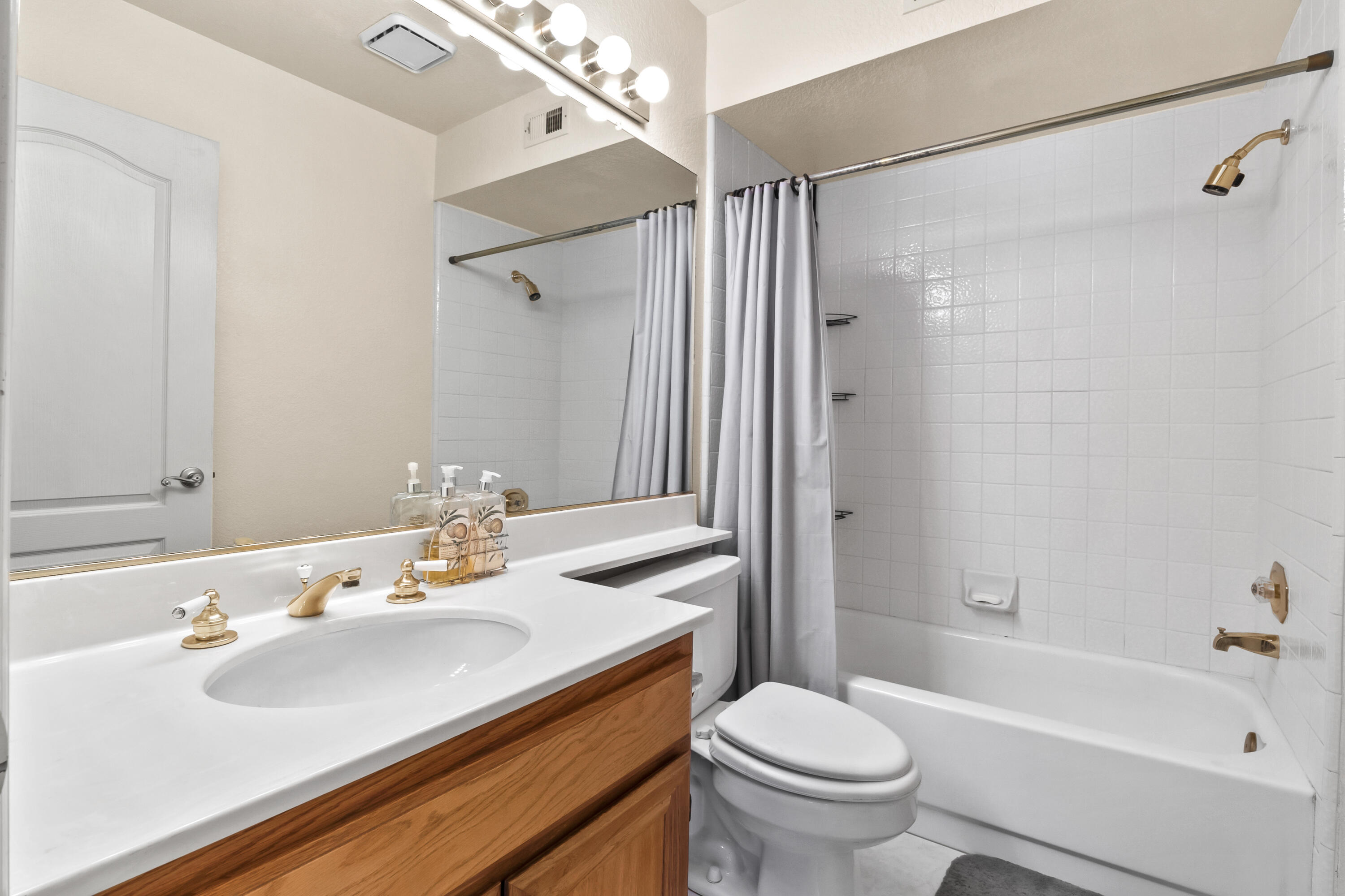 3066 Quarry Road Palmdale, CA 93550 - Photo 22 of 43 a bathroom with a sink toilet and shower