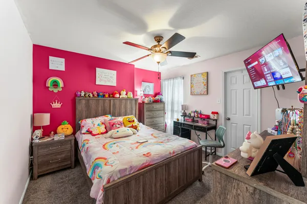 a utility room with dryer washer and a view of living room