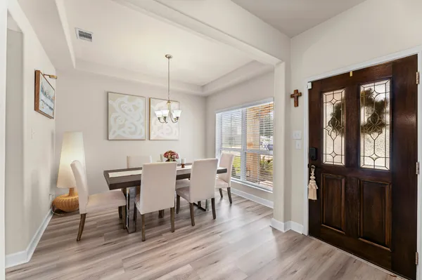 a view of a hallway with wooden floor and closet area