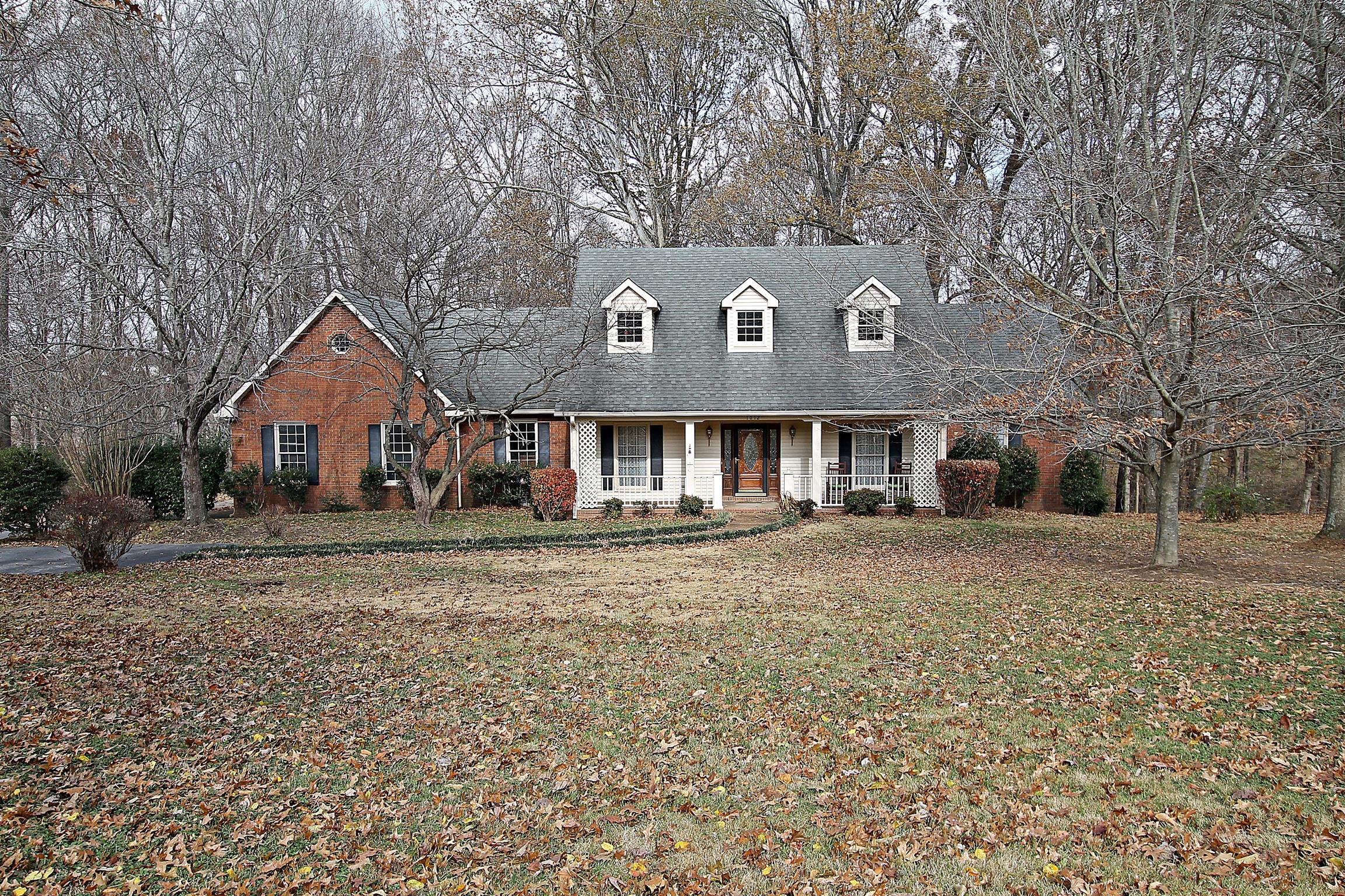 1012 Laura Lane Springfield, TN 37172 - Photo 1 of 30 a front view of a house with a yard