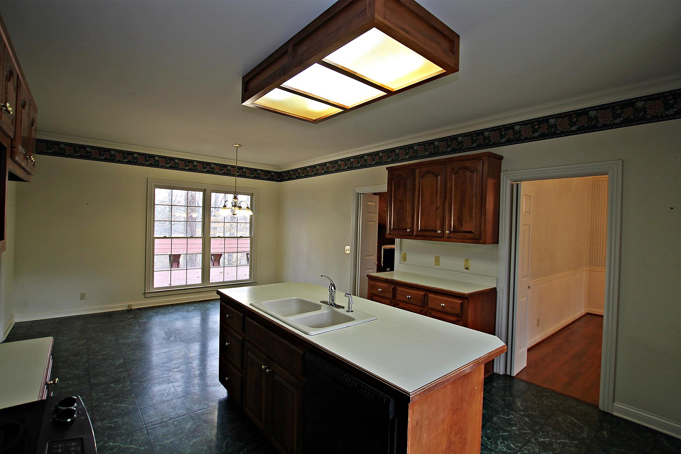 1012 Laura Lane Springfield, TN 37172 - Photo 10 of 30 a kitchen with a sink cabinets and wooden floor