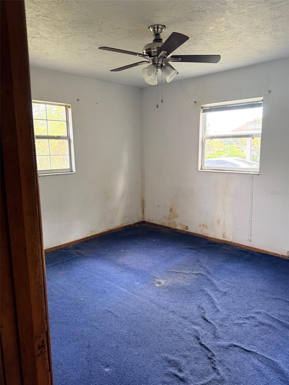 2114 Southwest 7th Street Ocala, FL 34471 - Photo 9 of 10 a view of an empty room with a window