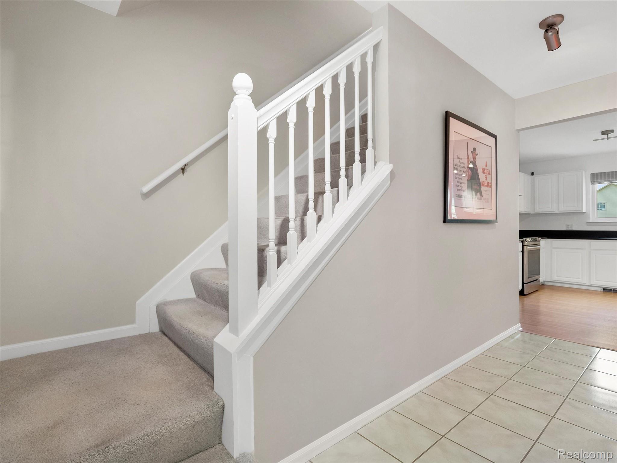 2172 Orpington Road Troy, MI 48083 - Photo 13 of 27 Stairs featuring baseboards and tile patterned floors