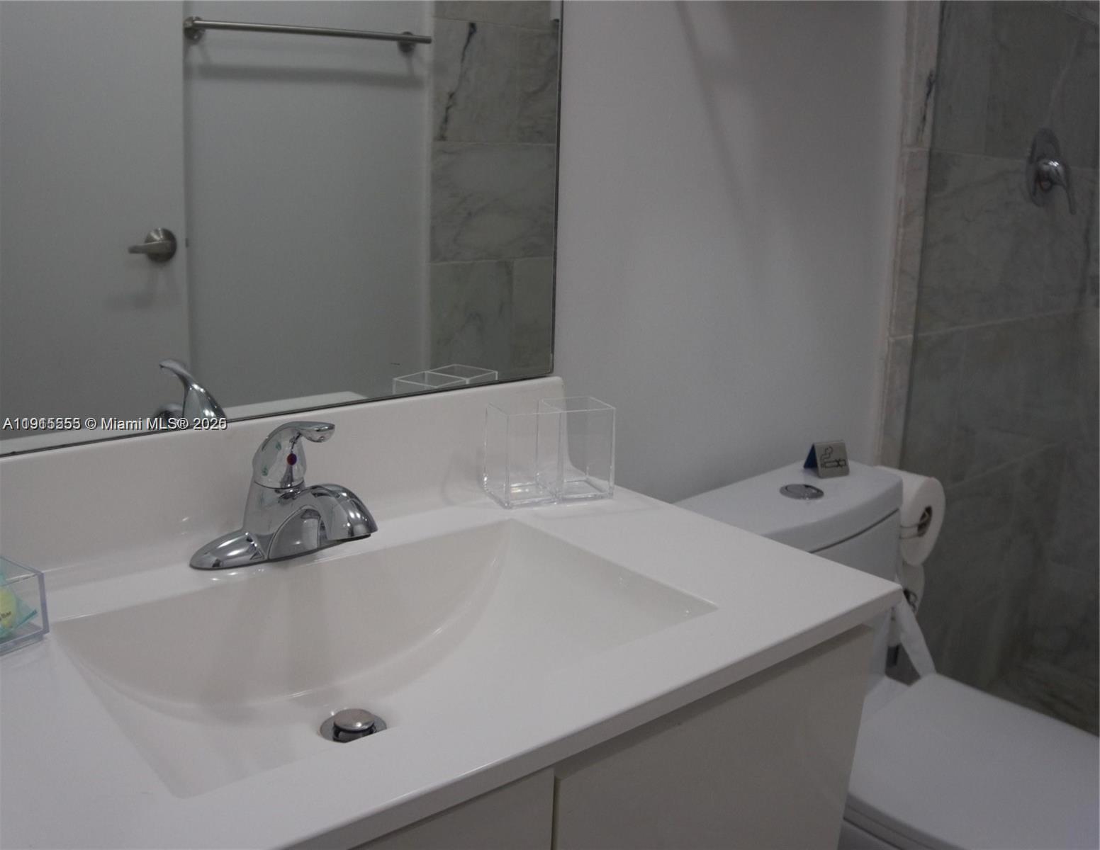 810 7th Street, Unit 107 Miami Beach, FL 33139 - Photo 13 of 14 a bathroom with a sink and a tub