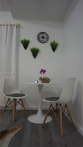a kitchen with a refrigerator and cabinets