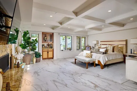 a spacious bedroom with a bed and window