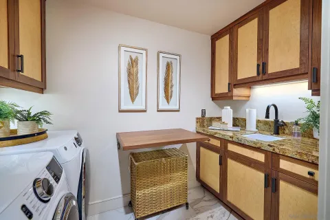 a view of hallway with furniture and a window