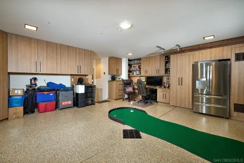 a kitchen with refrigerator and window