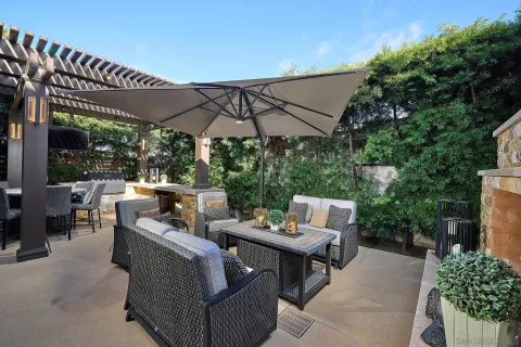 a patio with a patio table and chairs