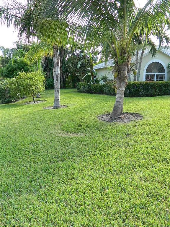 4709 Southeast Robertson Road Stuart, FL 34997 - Photo 38 of 41 a view of white house with a yard