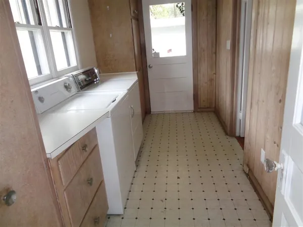 a bathroom with a sink a mirror and a shower