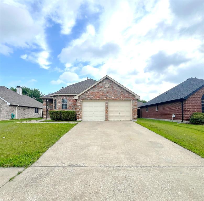a front view of a house with yard