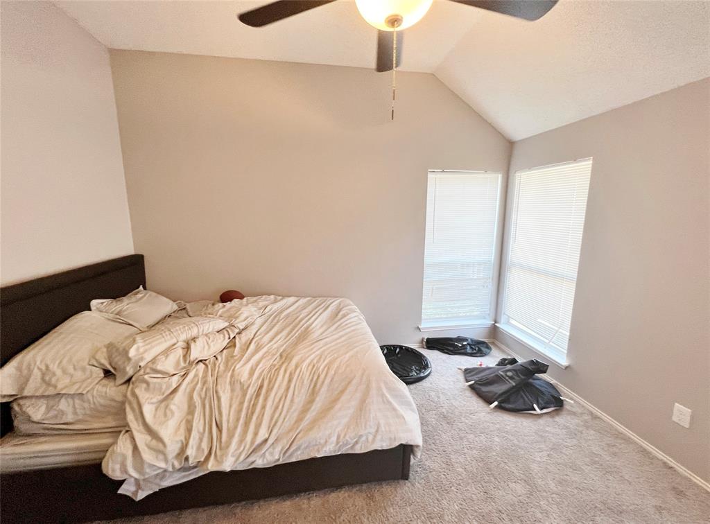 112 Walnut Lane Rockwall, TX 75032 - Photo 15 of 19 a bedroom with a bed and a window