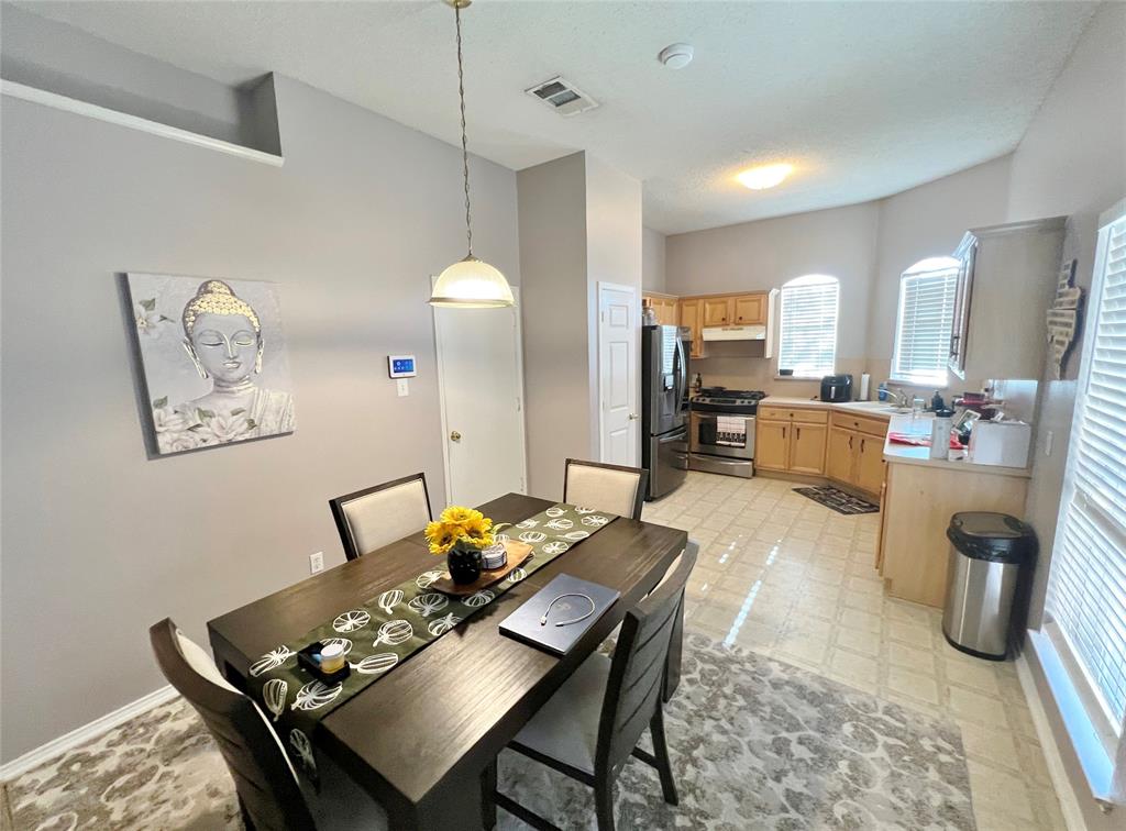 112 Walnut Lane Rockwall, TX 75032 - Photo 6 of 19 a view of a dining room with furniture