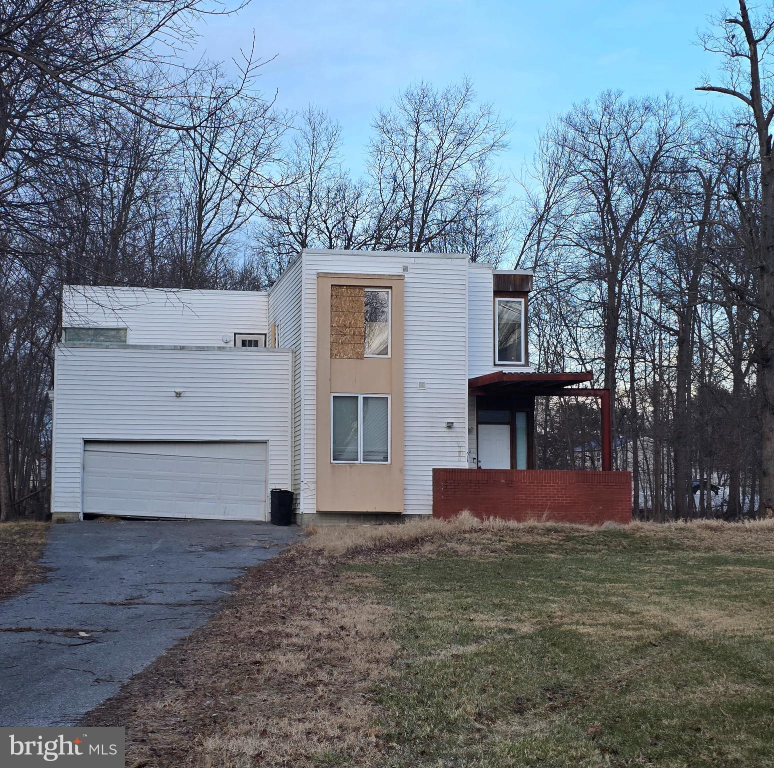 4814 Oakland Park Road Randallstown, MD 21133 - Photo 1 of 5 a front view of a house with a yard
