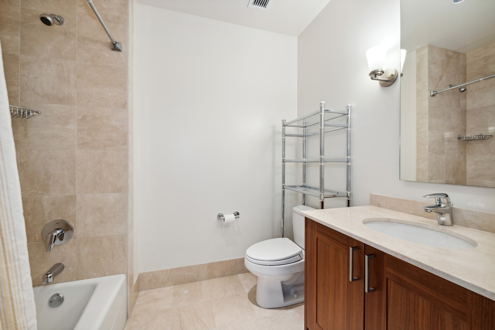 10 East Delaware Place, Unit 12E Chicago, IL 60611 - Photo 15 of 25 a bathroom with a sink a toilet and shower