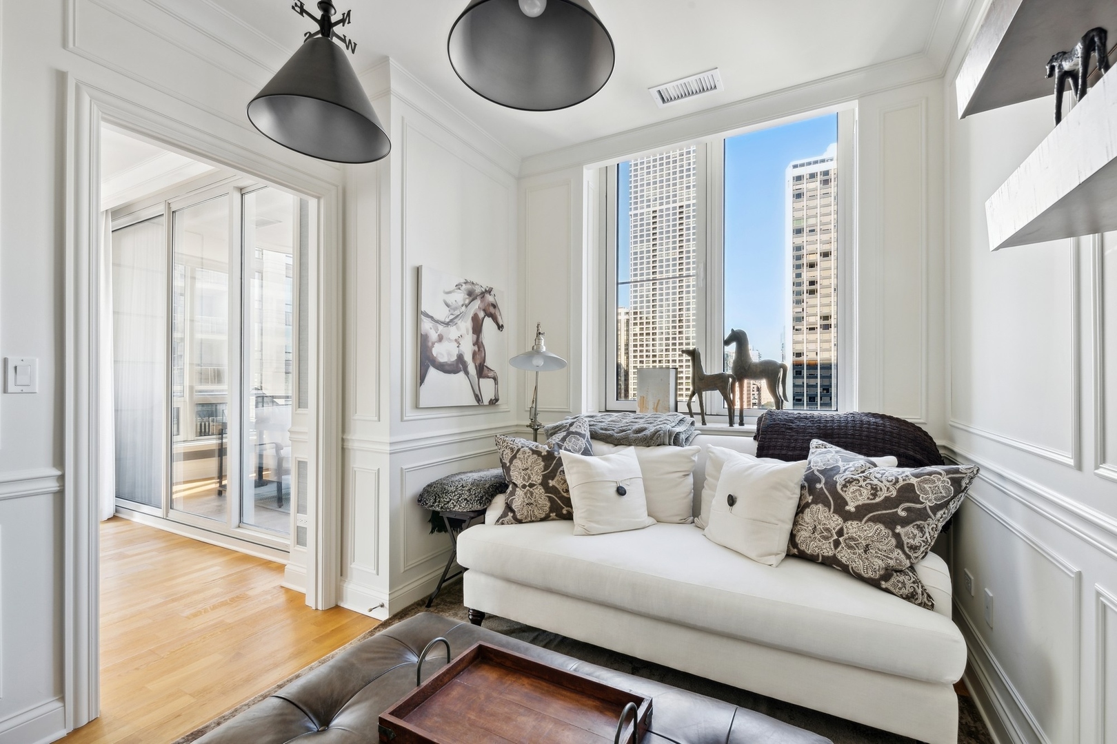 10 East Delaware Place, Unit 12E Chicago, IL 60611 - Photo 10 of 25 a living room with furniture and a large window