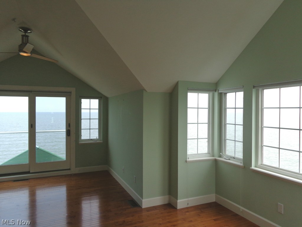 24 D Cedar Point Road Sandusky, OH 44870 - Photo 10 of 25 Master suite w/Lake Erie views, hard wood flooring, slider patio door to the outside composite deck.