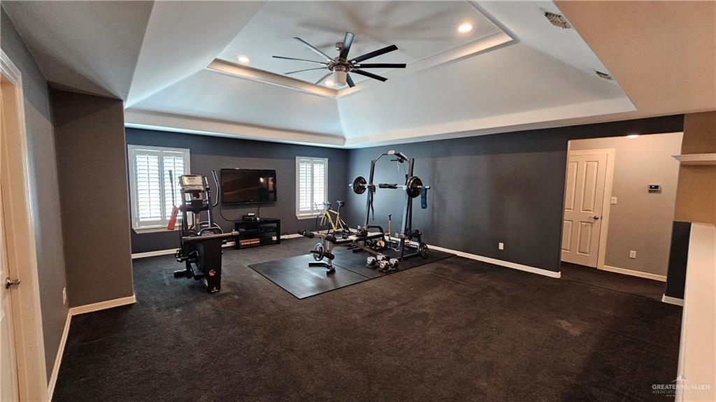 4711 North Stewart Road Palmhurst, TX 78573 - Photo 17 of 40 a view of a livingroom with workspace and a ceiling fan