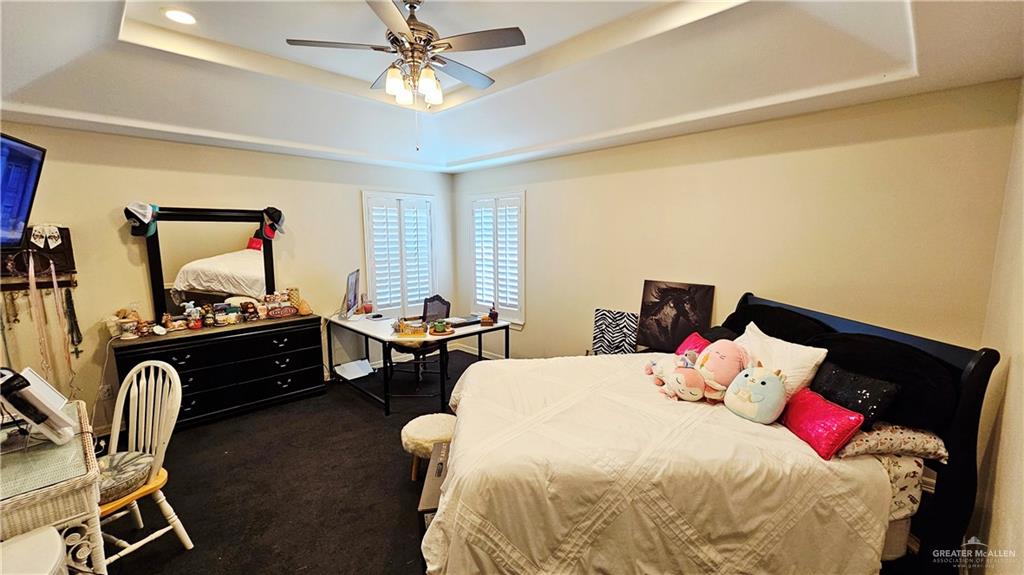 4711 North Stewart Road Palmhurst, TX 78573 - Photo 23 of 40 a bed room with a bed chair and a window