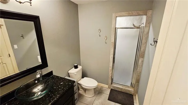 a bathroom with a toilet and a mirror