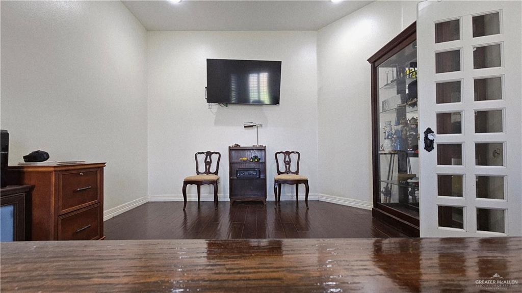 4711 North Stewart Road Palmhurst, TX 78573 - Photo 8 of 40 a view of a livingroom with furniture and wooden floor