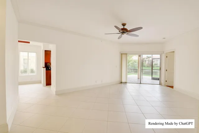 a view of a livingroom with a chandelier fan and windows