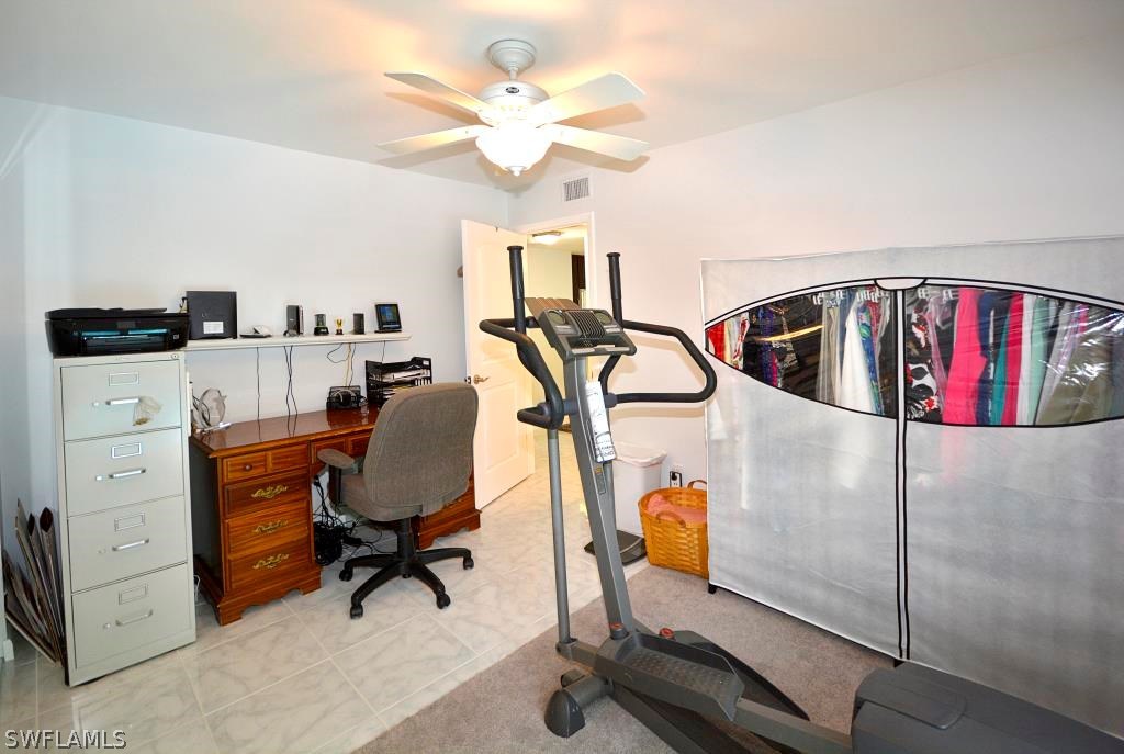 5919 Mackerel Road Bokeelia, FL 33922 - Photo 17 of 27 a view of a workspace with furniture