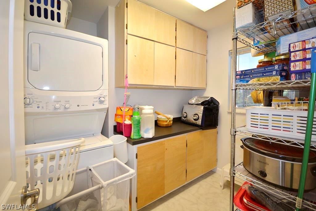5919 Mackerel Road Bokeelia, FL 33922 - Photo 18 of 27 a kitchen with a stove and a white cabinet