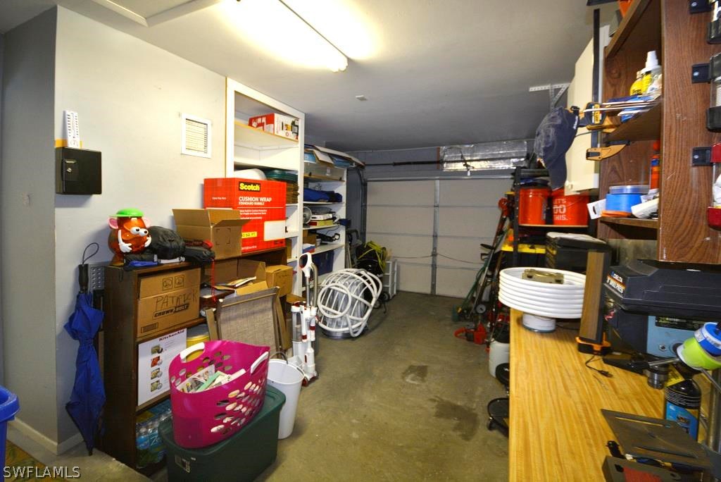 5919 Mackerel Road Bokeelia, FL 33922 - Photo 19 of 27 a room with gym equipment and a flat screen tv