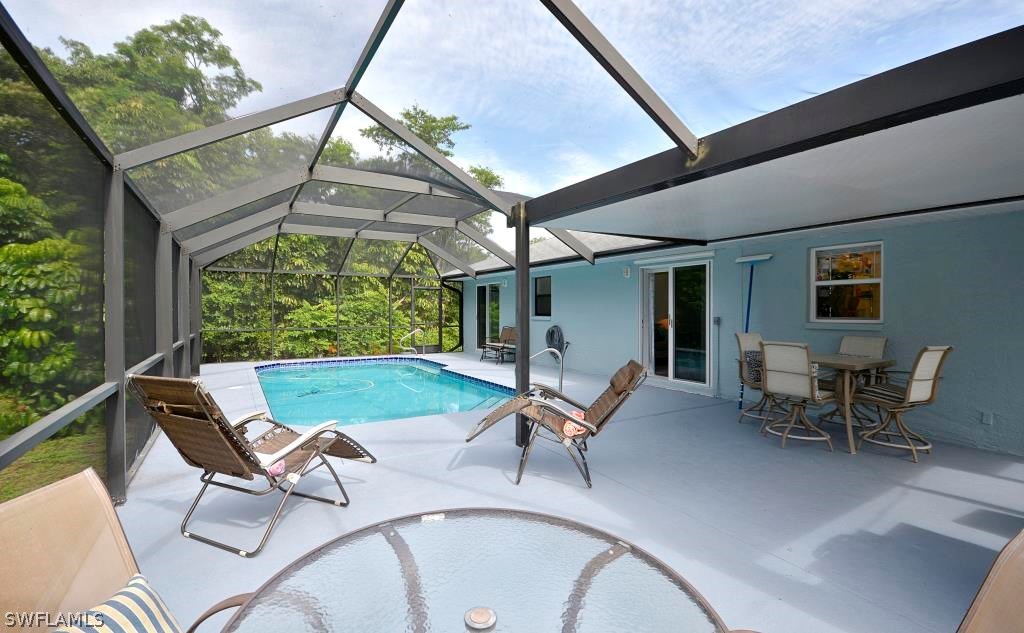 5919 Mackerel Road Bokeelia, FL 33922 - Photo 22 of 27 a view of backyard with outdoor seating and plants