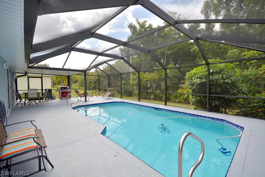 5919 Mackerel Road Bokeelia, FL 33922 - Photo 24 of 27 a view of swimming pool with a patio