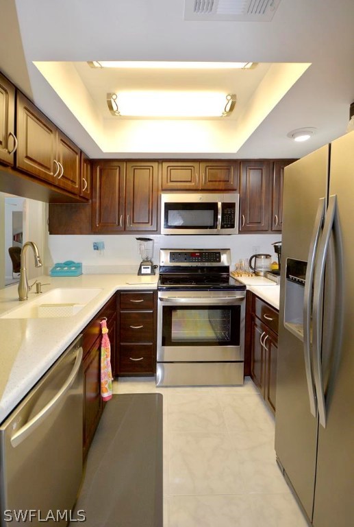 5919 Mackerel Road Bokeelia, FL 33922 - Photo 3 of 27 a kitchen with kitchen island a counter top space stainless steel appliances and cabinets