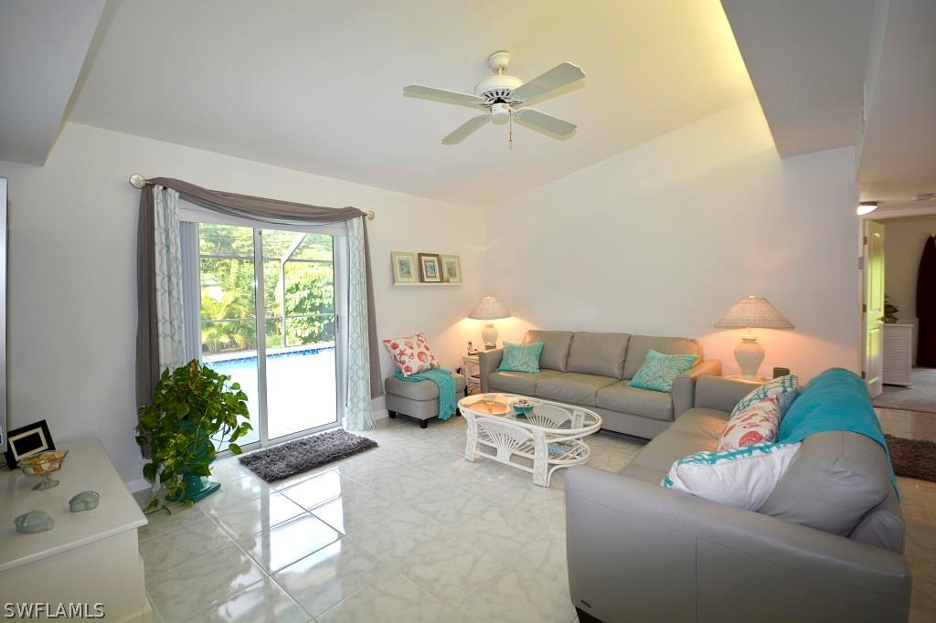 5919 Mackerel Road Bokeelia, FL 33922 - Photo 6 of 27 a living room with furniture and a window