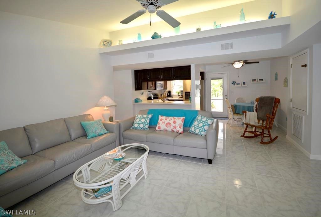 5919 Mackerel Road Bokeelia, FL 33922 - Photo 8 of 27 a living room with furniture and a couch