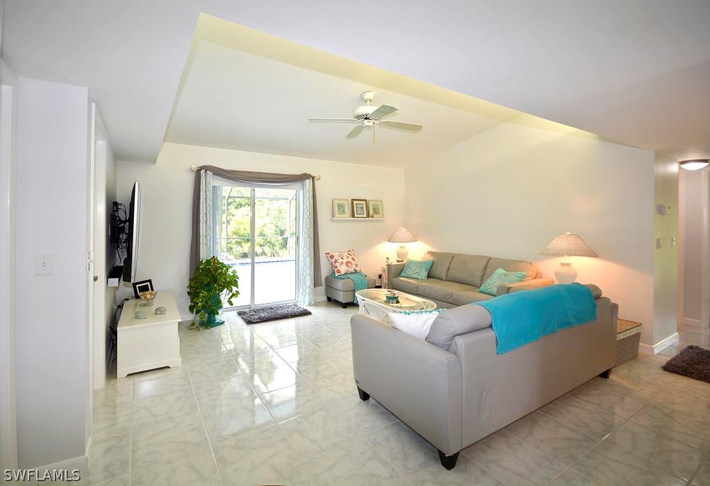 5919 Mackerel Road Bokeelia, FL 33922 - Photo 9 of 27 a living room with furniture and wooden floor