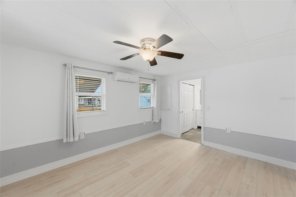 10810 Freedom Drive Port Richey, FL 34668 - Photo 19 of 65 a view of a livingroom with a ceiling fan and window