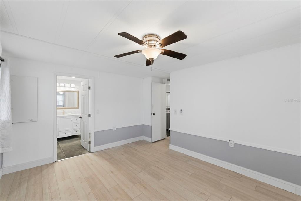 10810 Freedom Drive Port Richey, FL 34668 - Photo 20 of 65 a view of empty room with wooden floor