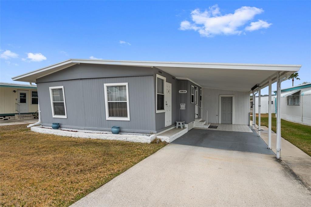 10810 Freedom Drive Port Richey, FL 34668 - Photo 2 of 65 a view of a house with a patio