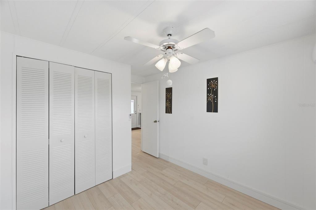 10810 Freedom Drive Port Richey, FL 34668 - Photo 25 of 65 a view of an empty room with a fan